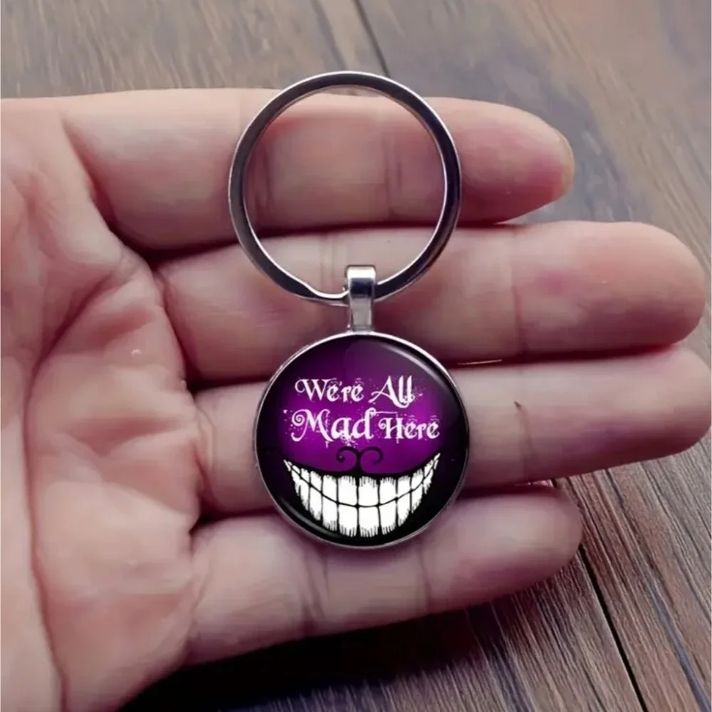 Cheshire cat we are all mad here glow in the dark keychain